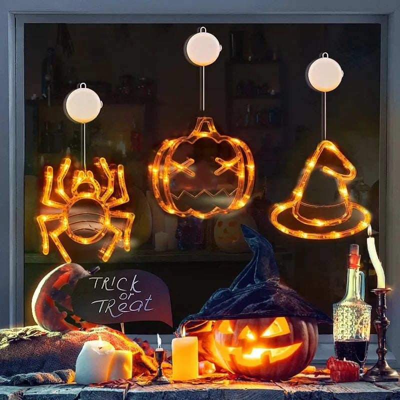 Halloween LED window lights set with spider, pumpkin and ghost designs on suction cups