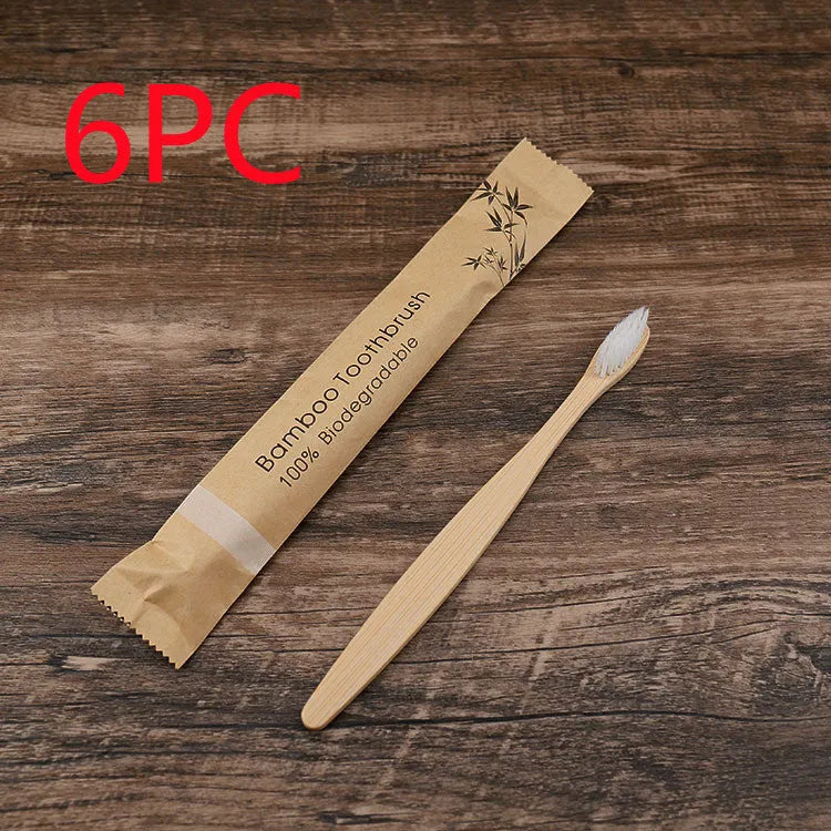 Set of 10 bamboo toothbrushes with charcoal bristles in various colours showing 17.5cm handles