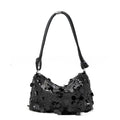 Gold, silver, or black soft polyester underarm crossbody bag measuring 25x11x15 cm.