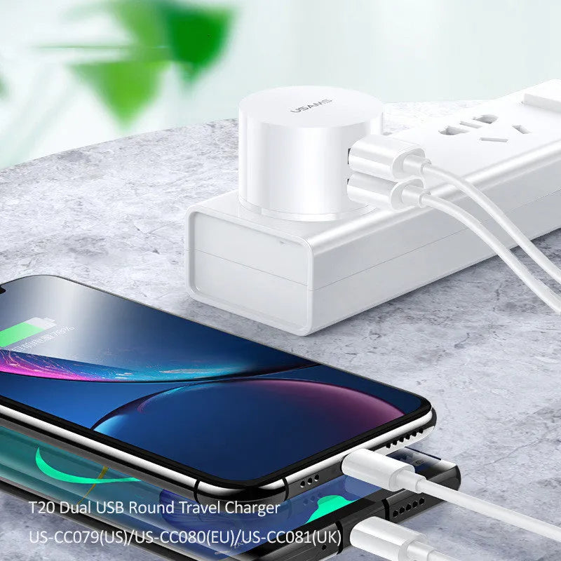 White portable USB phone charger with universal international adapter for UK US and EU power sockets