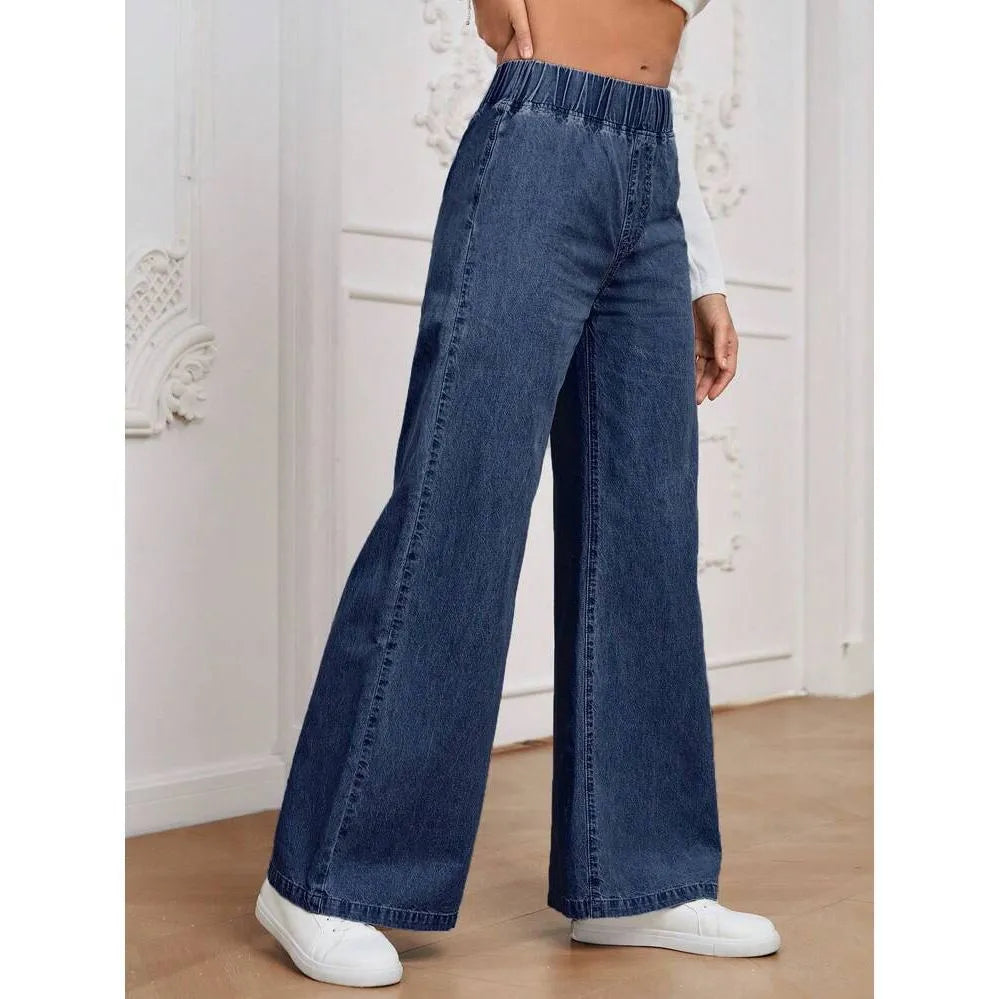 Light blue washed wide-leg straight jeans with mid-waist design and zip placket closure on hanger
