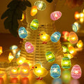 Carrot and rabbit shaped Easter LED string lights with battery box and PVC shell, available in five colours