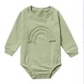 Long sleeve baby romper in waffle cotton fabric, shown in beige with cotton rope tie closure.