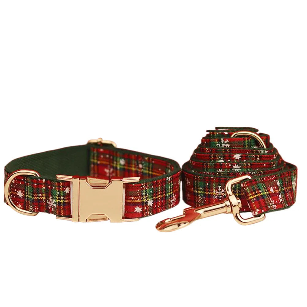 Green snowflake patterned cloth dog collar set with matching vest, leash, and bow for Christmas