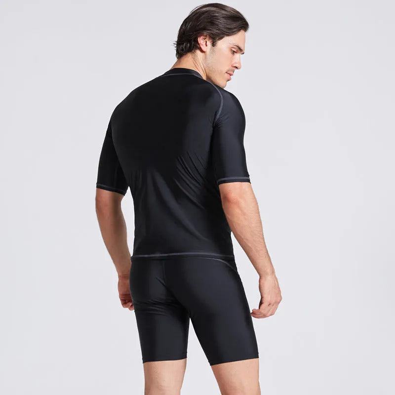 Men's blue quick-dry nylon two-piece swim set with half-sleeve top and swim pants laid flat