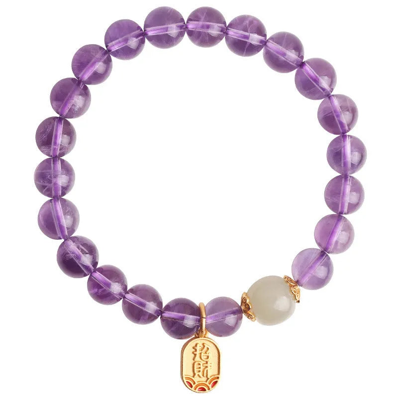 Amethyst purple geometric crystal bead bracelet ornament on a wrist.