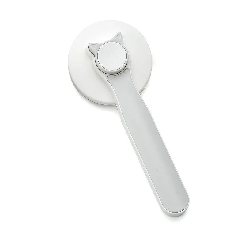 Self-cleaning slicker brush for dogs and cats with stainless steel pins and ergonomic handle