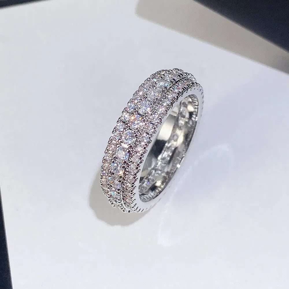 Geometric copper ring with triangle zircon inlay, shown in three metal colour options