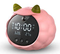 White Deer style smart alarm clock with digital display, silicone shell, and power cord.