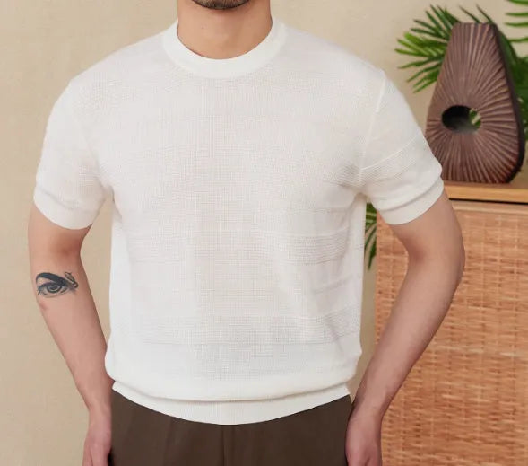 Pure cotton short sleeve T-shirt in off-white with a round neck, laid flat