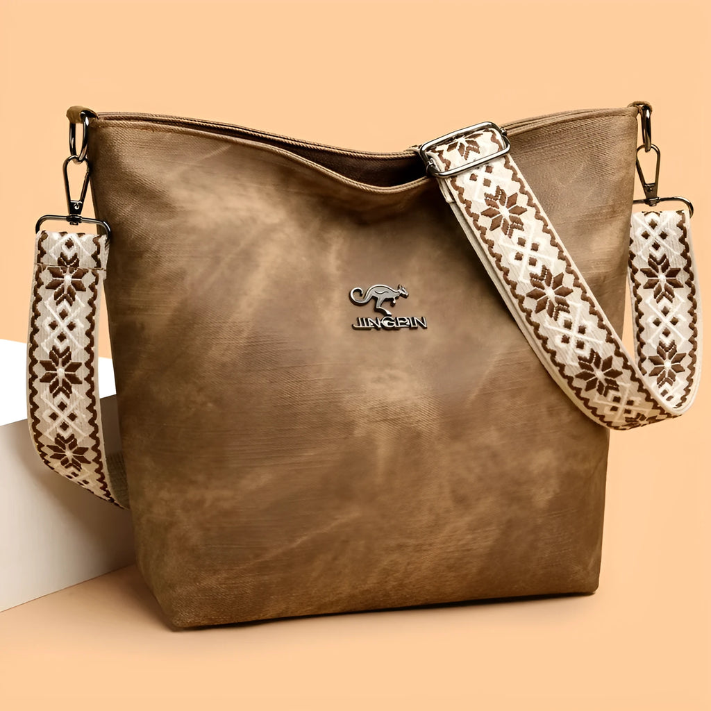 Soft PU large capacity crossbody bag in pink, grey, or yellow with an adjustable shoulder strap.