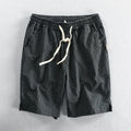 Men's striped casual shorts in light blue with elastic waistband, loose straight cut, cotton fabric