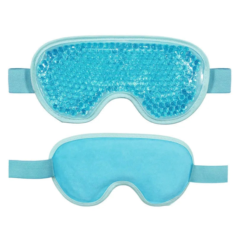 White portable eye therapy device with attached eye mask, showing USB-C charging port and temperature control buttons