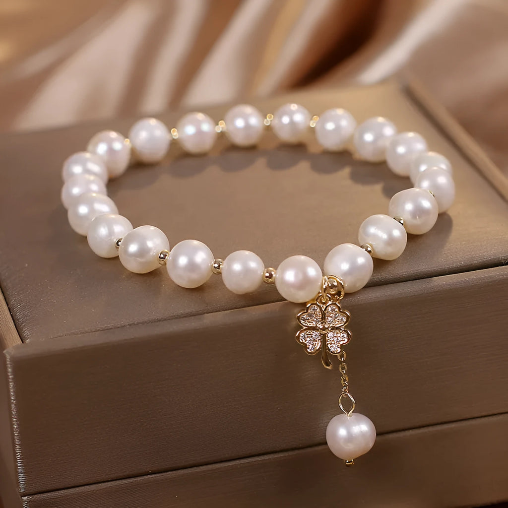 White freshwater pearl bracelet with four-leaf clover charm, alloy material, and sequin detail for women