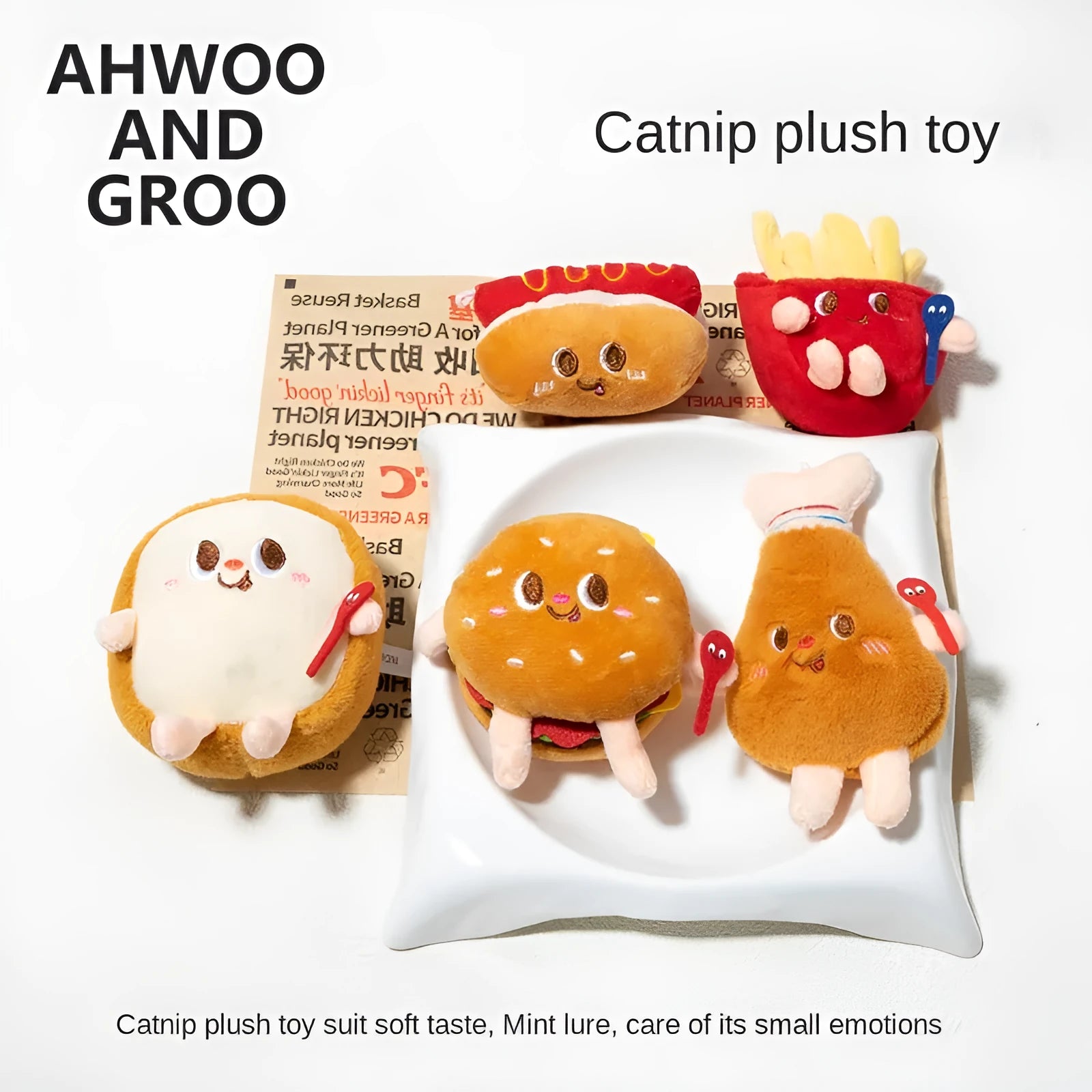 Set of five colourful cat chewing toys shaped like hamburger, chicken legs, fries, hot dog, and bread slice on a white background.