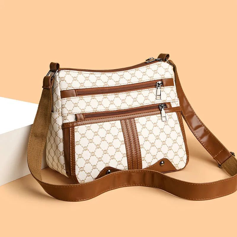 Brown women's crossbody bag with stitching pattern and shoulder strap