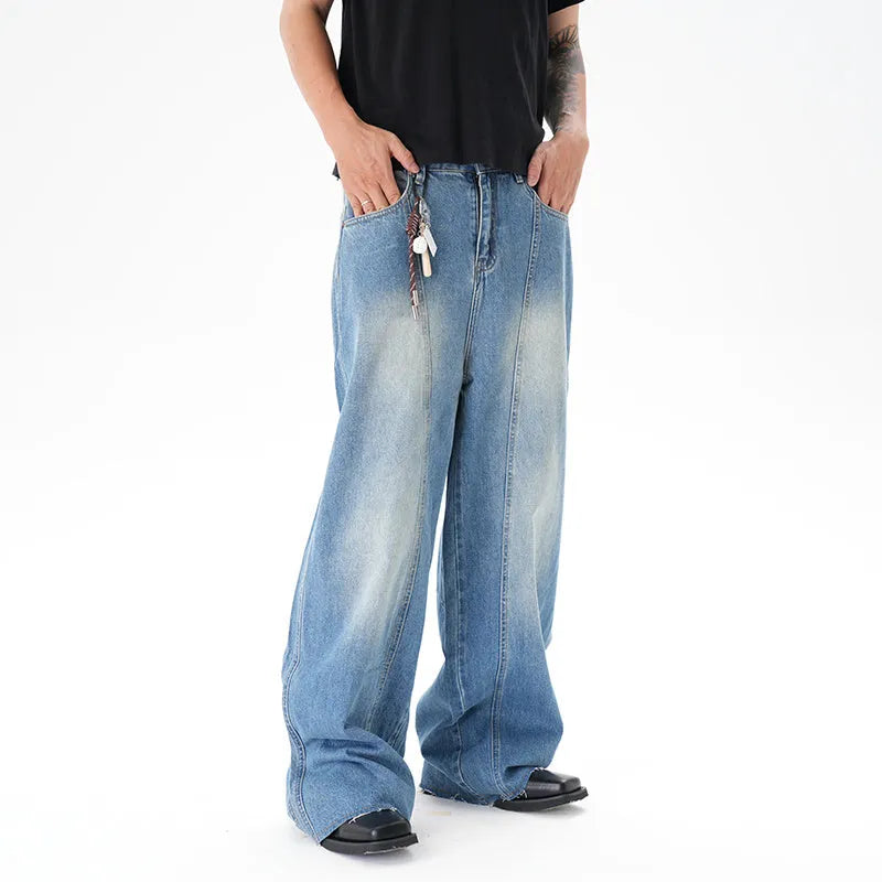 Light blue vintage washed wide leg denim jeans with a zipper fly on a mannequin.