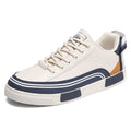 Men's beige, white and green canvas casual shoes with mesh panels, flat heel, and round toe.