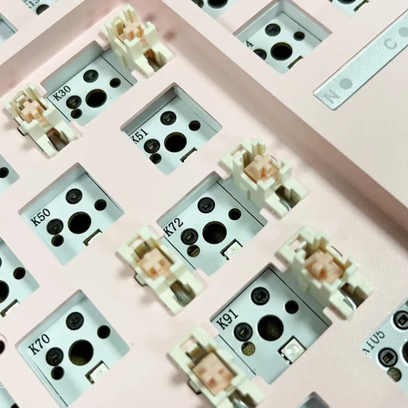 DIY mechanical keyboard kit with hot-swappable seat in multiple colour options including black, white, pink, and transparent cases