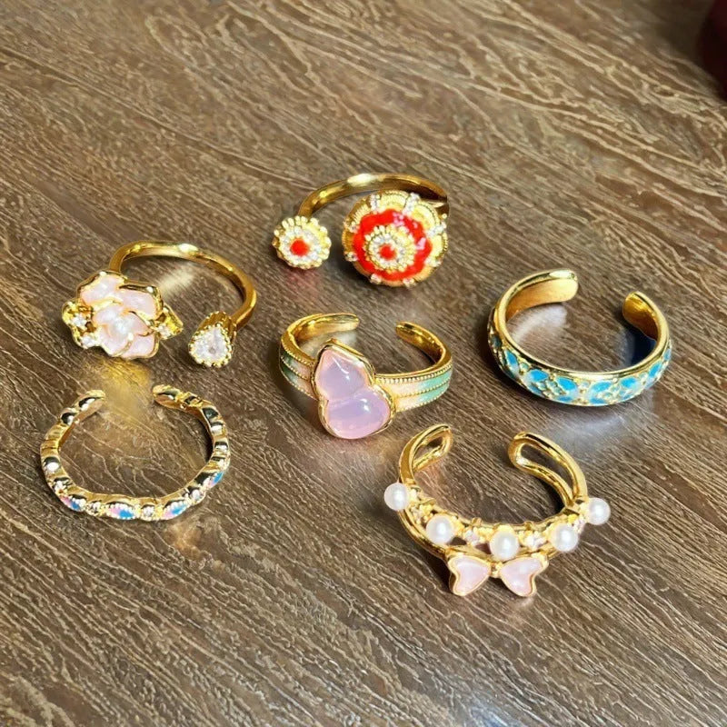 Adjustable copper ring with vintage oil-dripping gourd design, inlaid zircon stones, and flower and bow shapes in New Chinese style