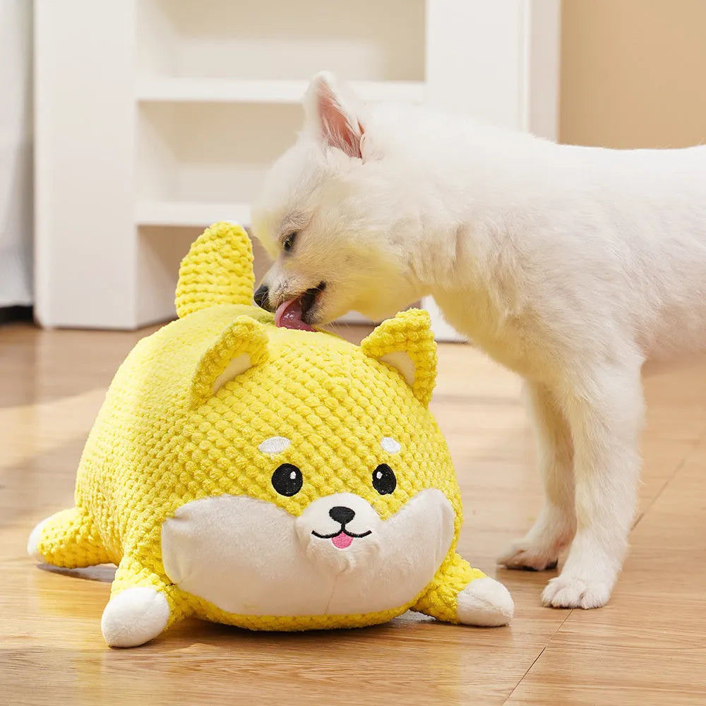 Calming plush dog toy with squeaker vocalisation feature in bite-resistant material