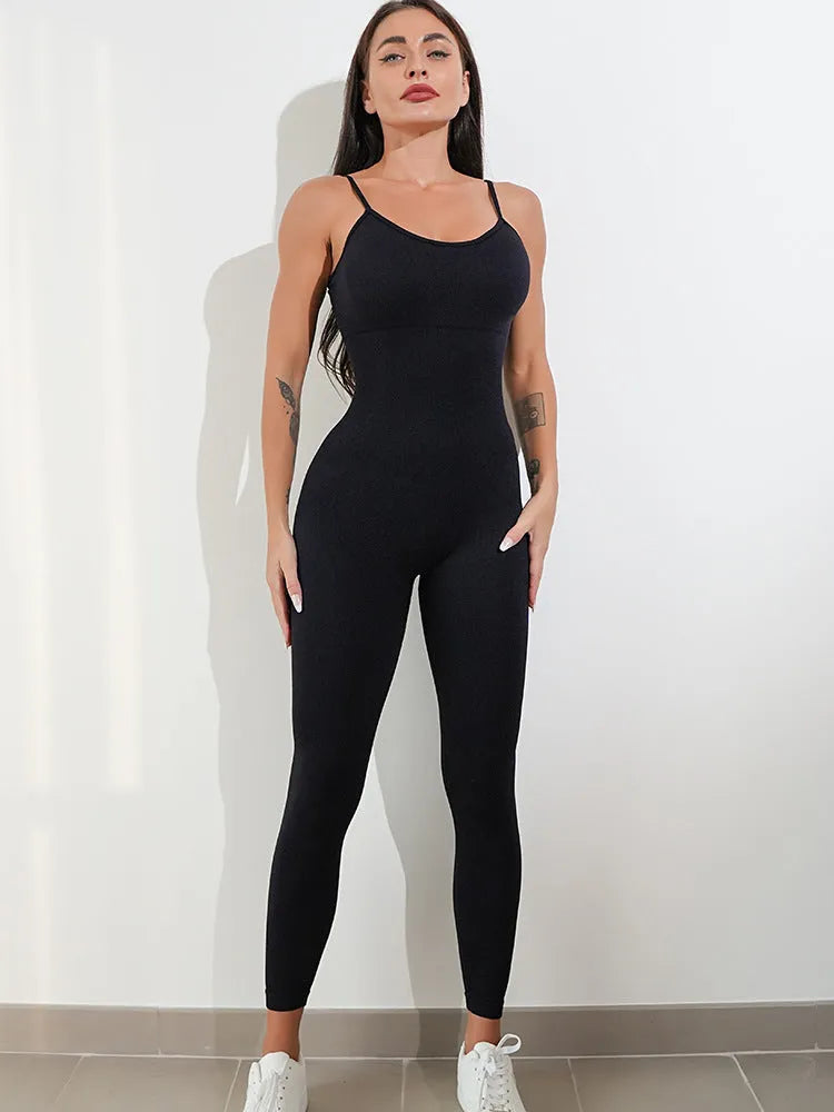 Women's black unitard jumpsuit with spaghetti straps and tummy control, made from nylon and spandex for stretch