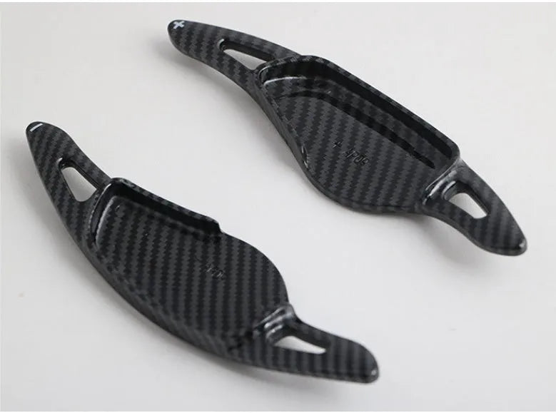 Car steering wheel paddle shifter modification in carbon fibre black finish on ABS plastic