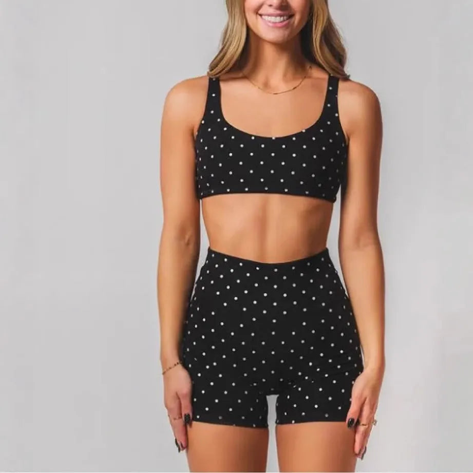 Black wave point two piece swimsuit set with sleeveless top and fifth pants, sizes XS to 2XL