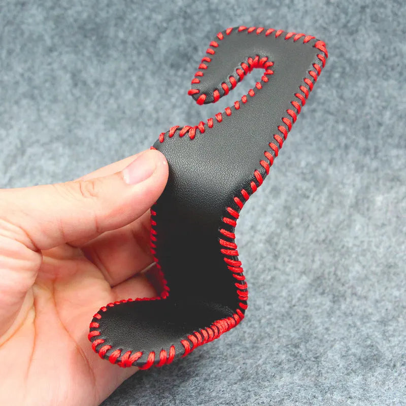 Gold-coloured stainless steel car seat back hook for organising bags on vehicle headrests.