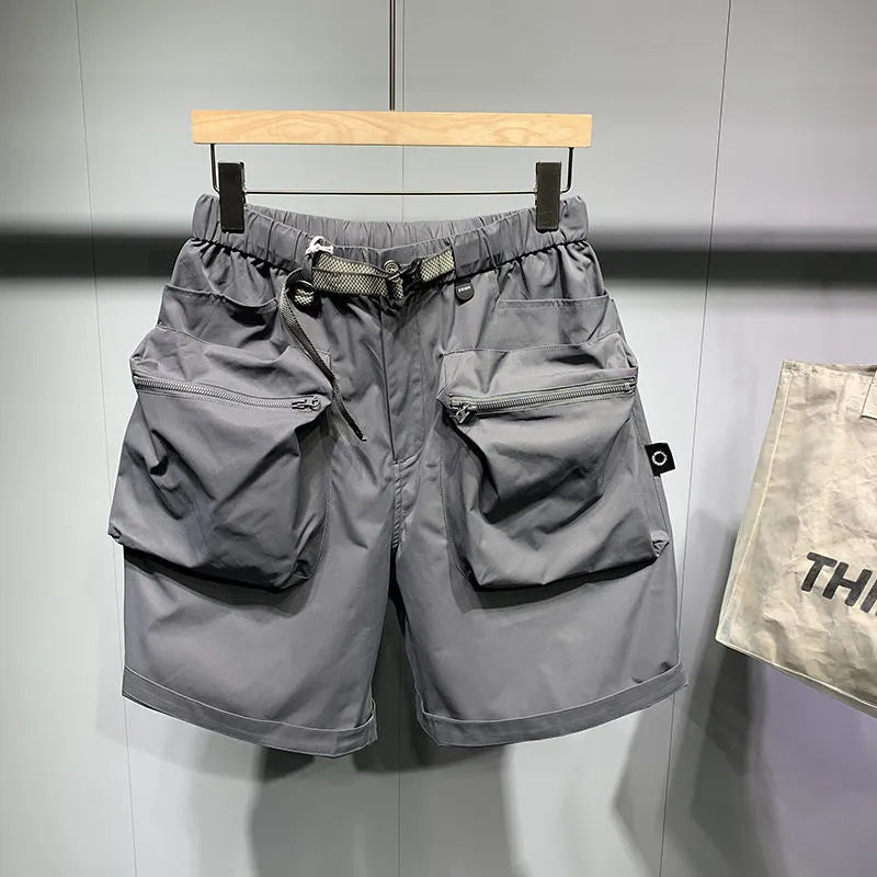 Men's black workwear shorts with loose fit, pockets, and non-ironing fabric, sized for waists up to 115kg