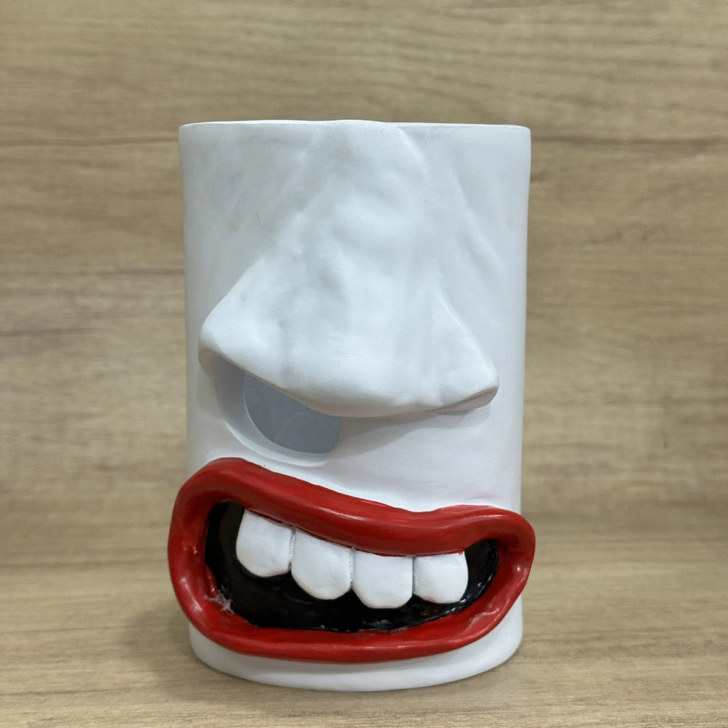 Resin tissue box holder with humorous design, dimensions 8.5cm by 14.6cm, on a desktop