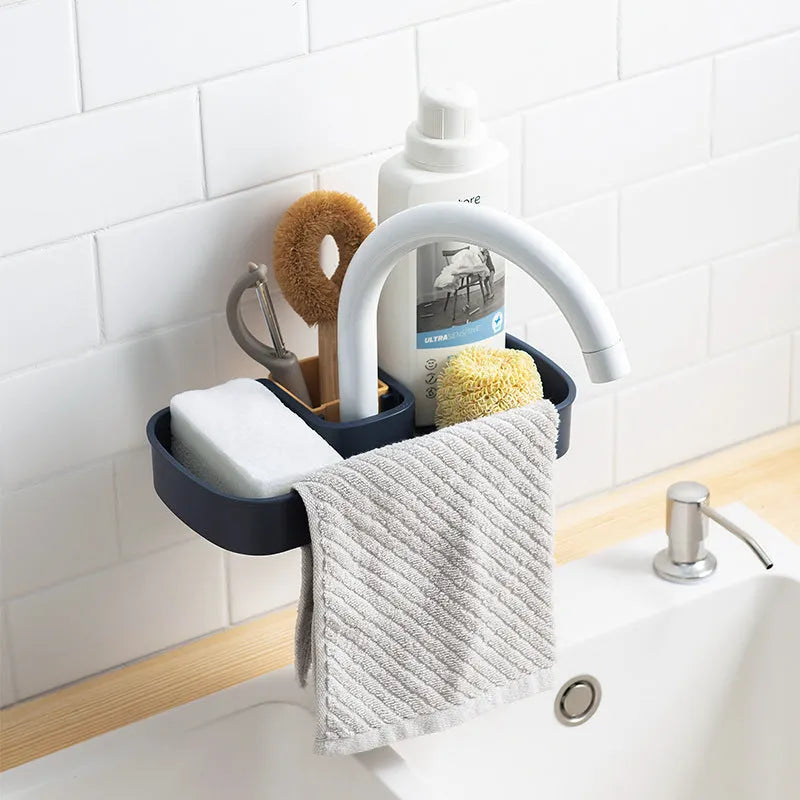 Blue adjustable sink shelf with sponge and brush storage mounted on kitchen faucet