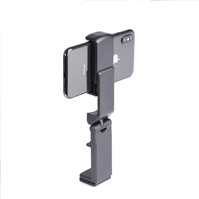 Black 360-degree rotating collapsible phone holder on desktop showing adjustable angle