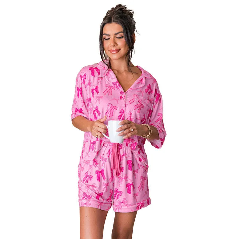 Pink bow print pajama two-piece set with top and trousers, lightweight polyester fabric for sleep and home use