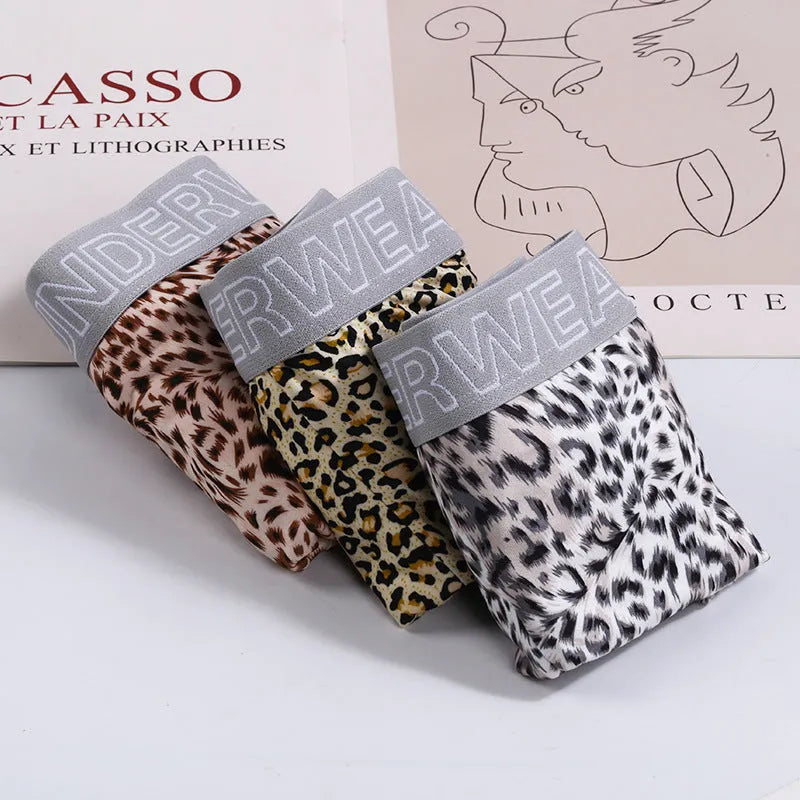 Men's leopard print underwear in milk silk polyester fabric showing loose fit and mid waist design