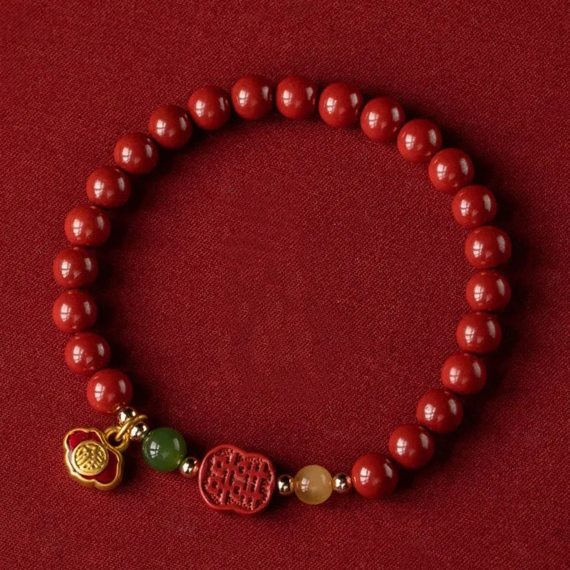 Handcrafted cinnabar bracelet with emperor sandstone beads and traditional fu character design in New Chinese style