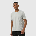 Man wearing a lightweight dark gray short sleeve sports top with reflective details on the sleeves.