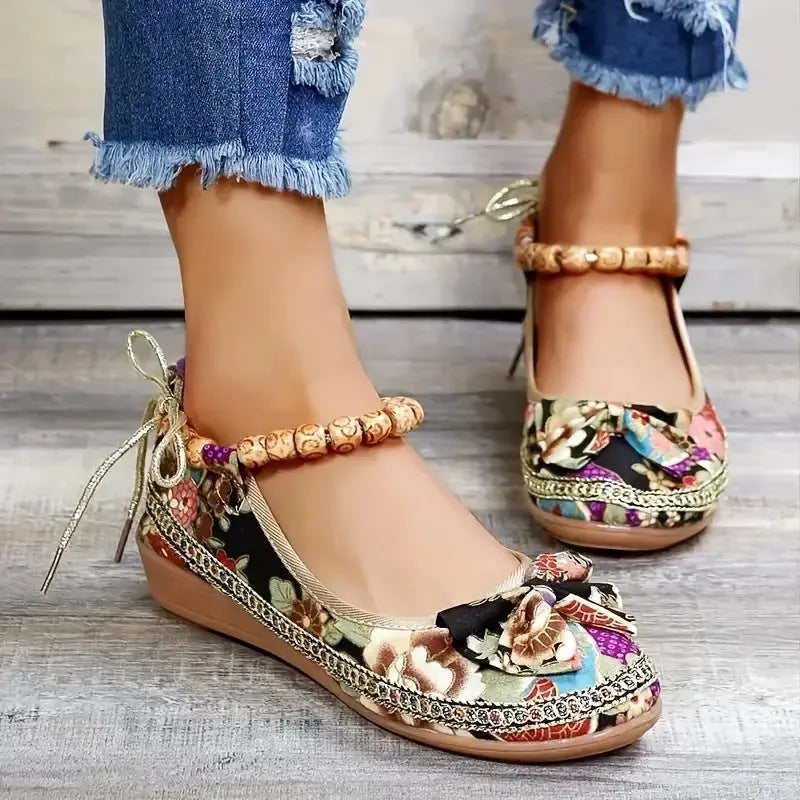 Black and red women's plus-size ethnic platform sandals with a cloth upper and elastic band.