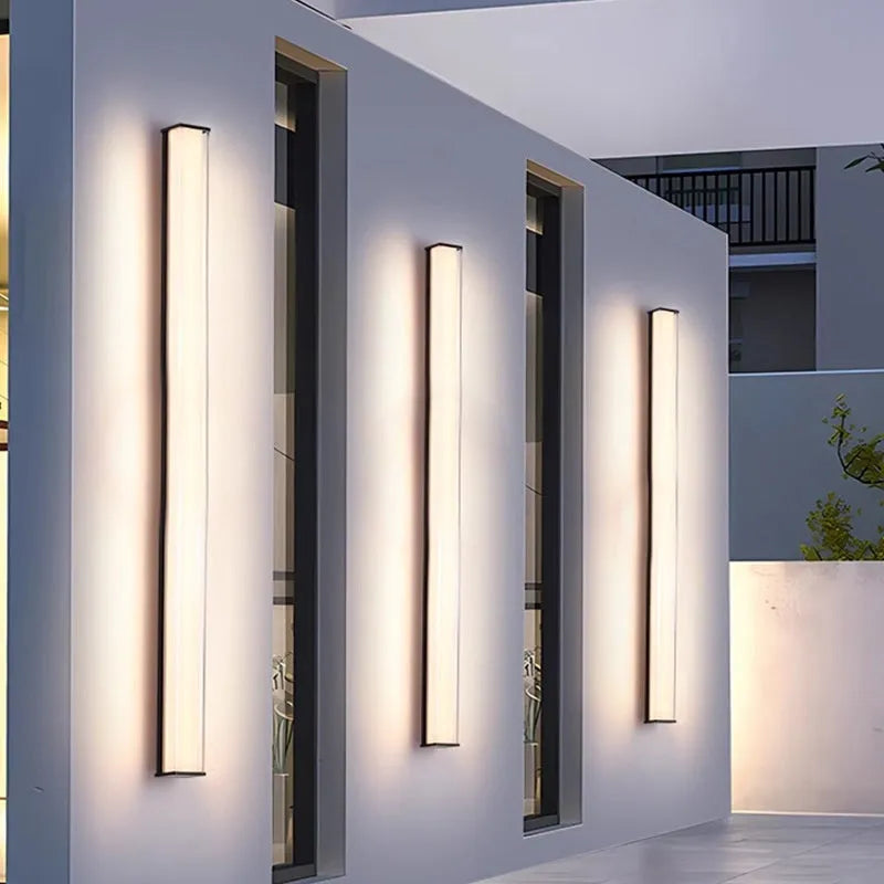Modern minimalist LED outdoor wall lamp with IP65 waterproof rating shown in courtyard setting