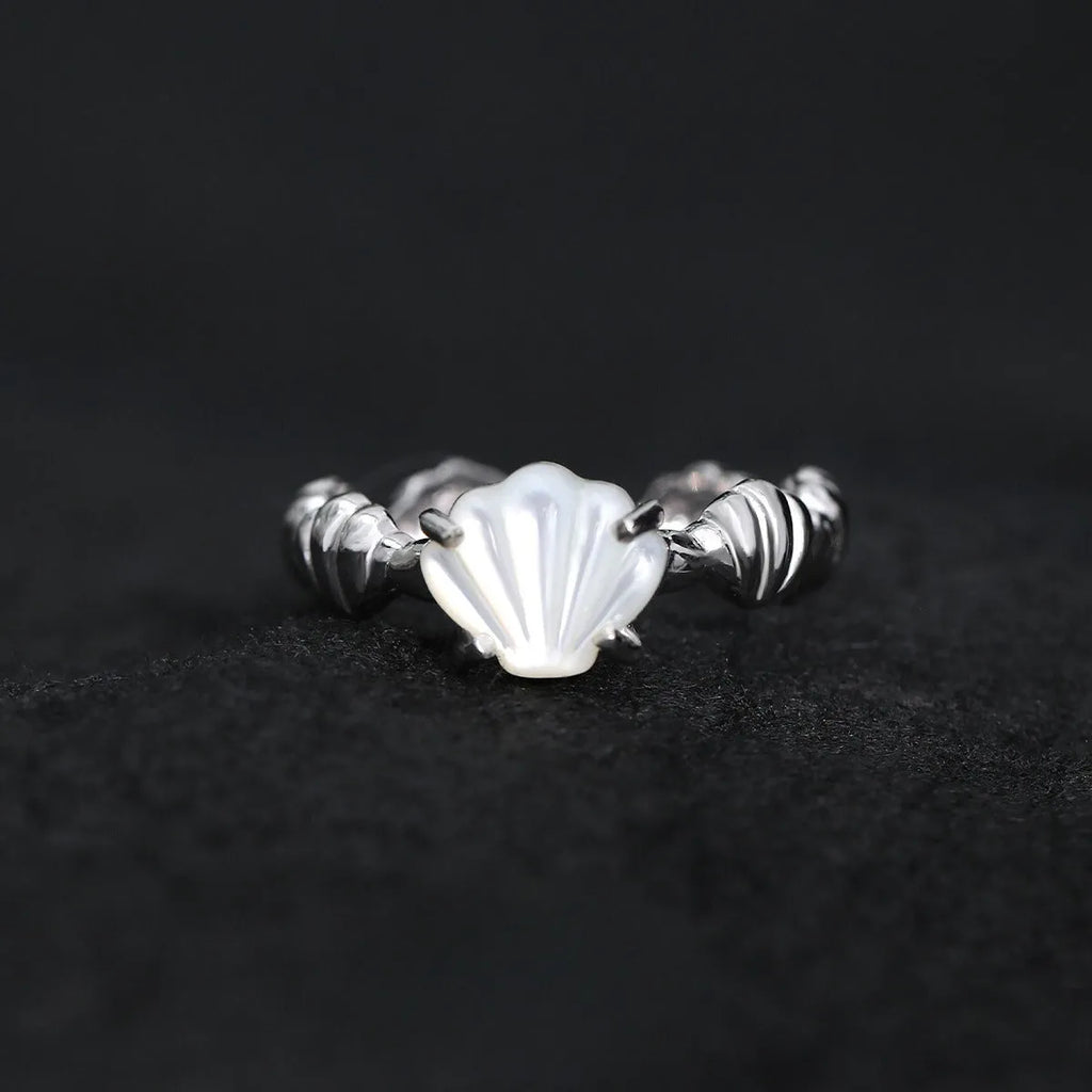 Adjustable silver ring with shell and tiger eye accents in gold electroplated finish showing opening mechanism
