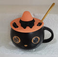 Black ceramic novelty mug with Halloween pumpkin, spoon couple, and cat design, 355ml capacity.
