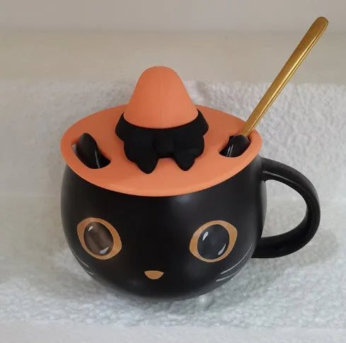 Black ceramic novelty mug with Halloween pumpkin, spoon couple, and cat design, 355ml capacity.
