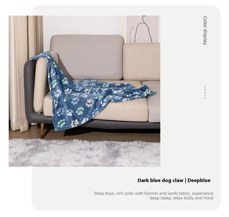 Double-sided dog blanket with cartoon patterns in blue dog, khaki paw, and blue paw designs on polyester flannel