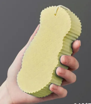 3D body rubbing sponge with fish scale pattern in white, grey, pink, or light blue, showing super-soft texture for gentle exfoliation