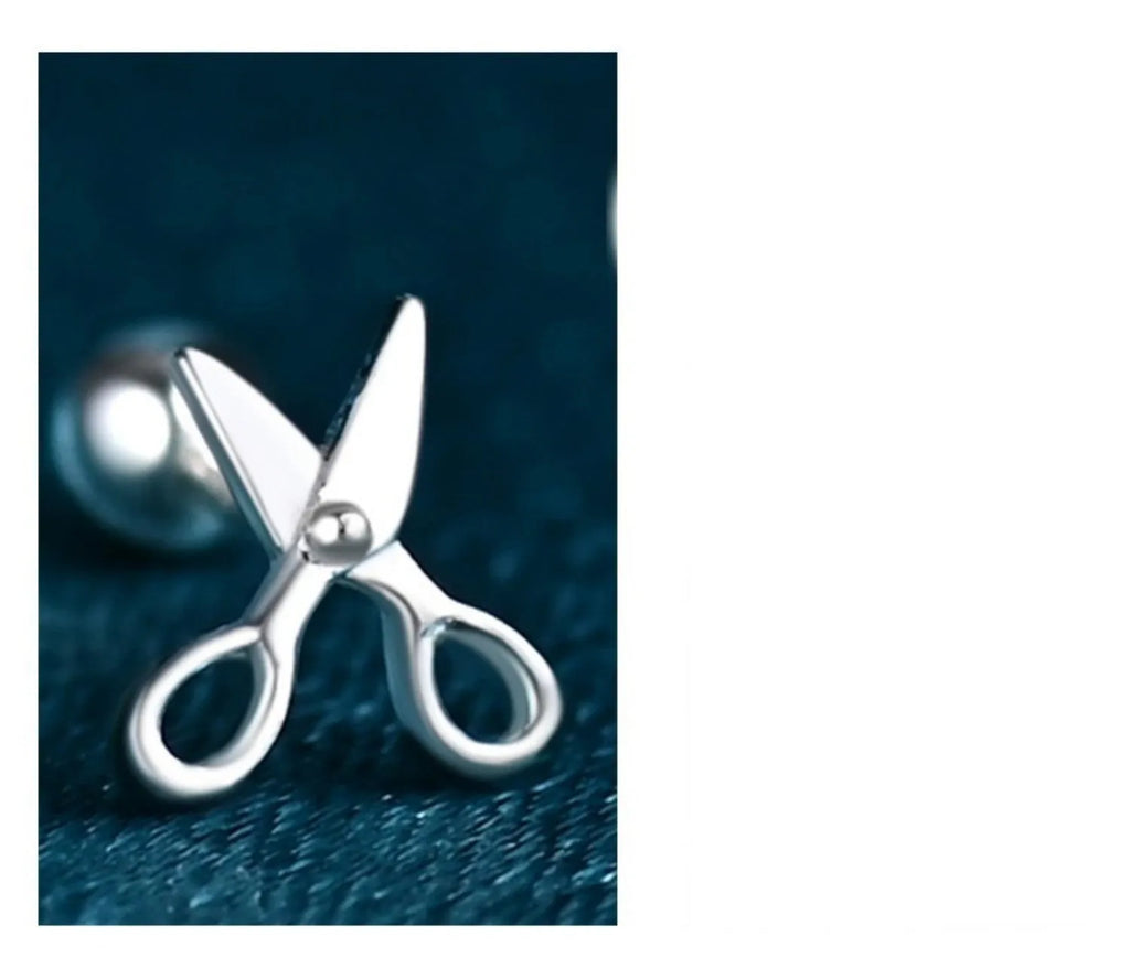 A pair of S999 pure silver earrings with screw-style closure shaped like miniature scissors.