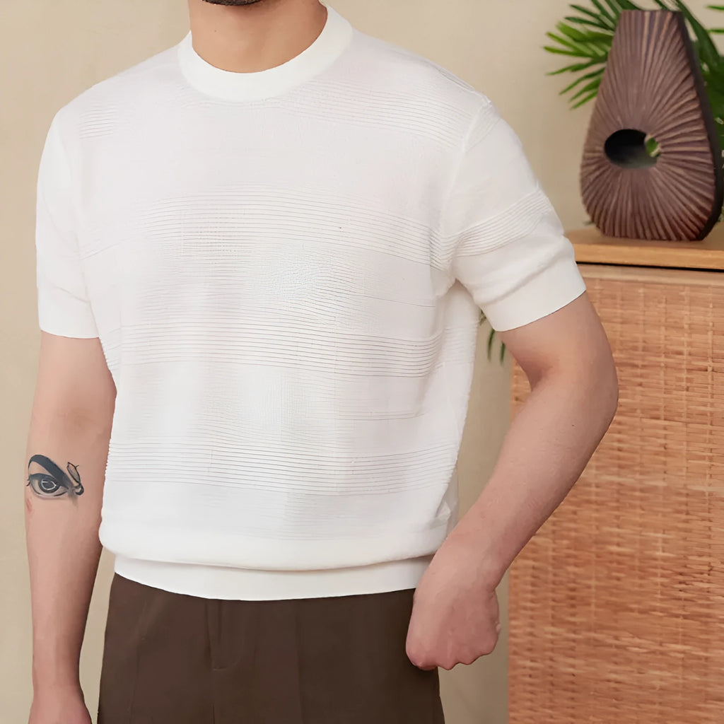 Pure cotton short sleeve T-shirt in off-white with a round neck, laid flat