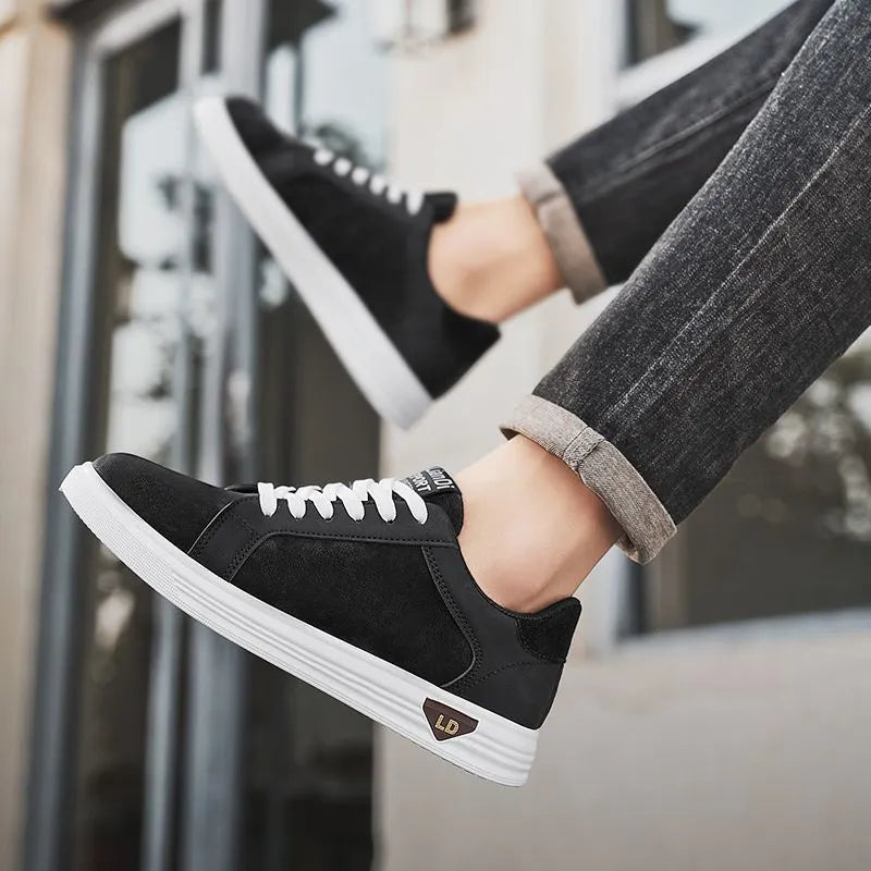 Men's black snake pattern PU leather casual sneakers with round toe and rubber sole on a white background.
