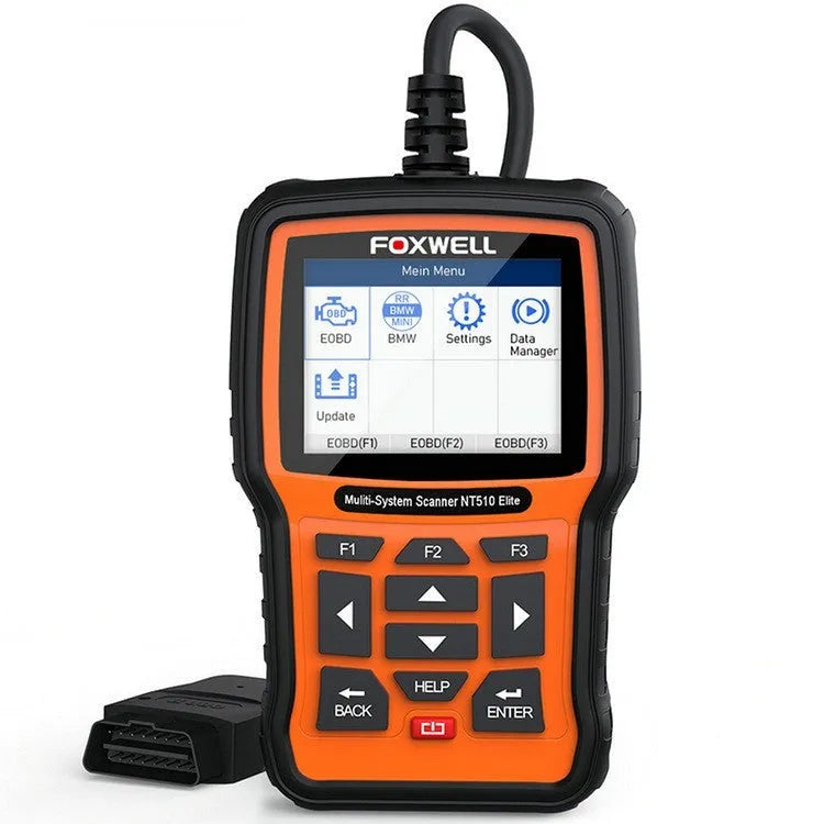 Foxwell NT510 orange and black automotive diagnostic tool with data cable on a workshop bench