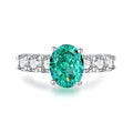 S925 sterling silver emerald ring with geometric shape and high carbon diamond inlay, showing elliptical design.