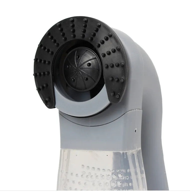 Grey portable pet hair vacuum cleaner and massage brush for dog and cat grooming on sofa